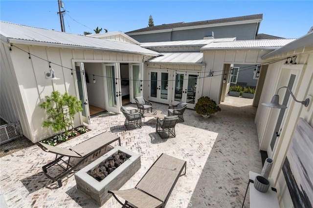 rear view of house featuring a patio and french doors