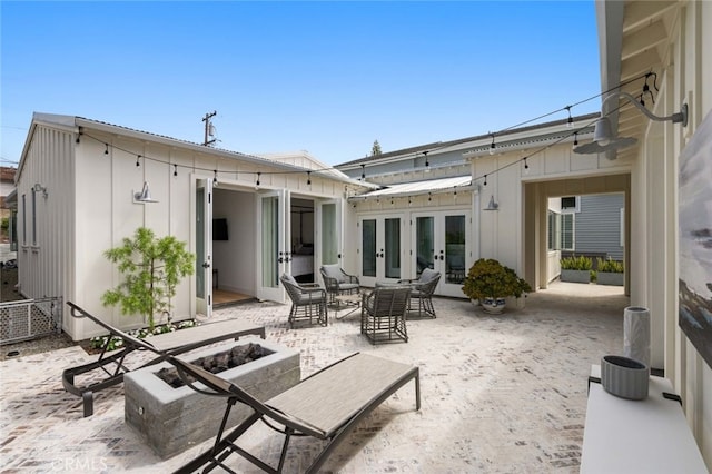 rear view of property with french doors and a patio