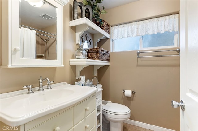 bathroom with toilet, curtained shower, and vanity