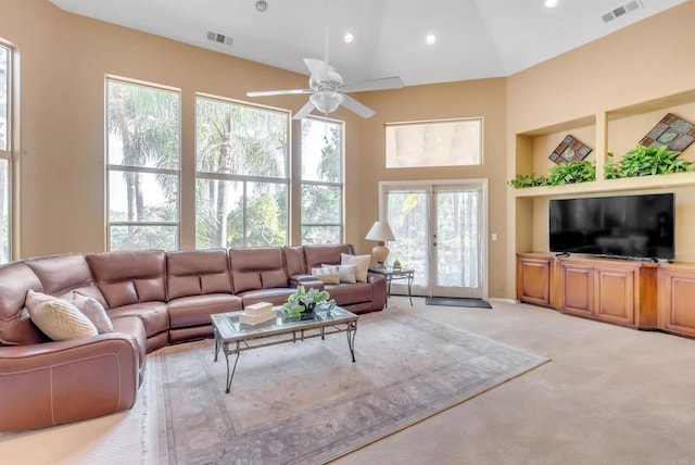 living room with visible vents, recessed lighting, a ceiling fan, and light colored carpet