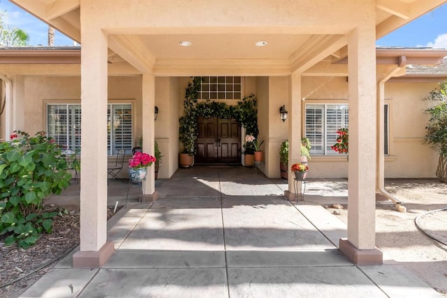 property entrance featuring stucco siding