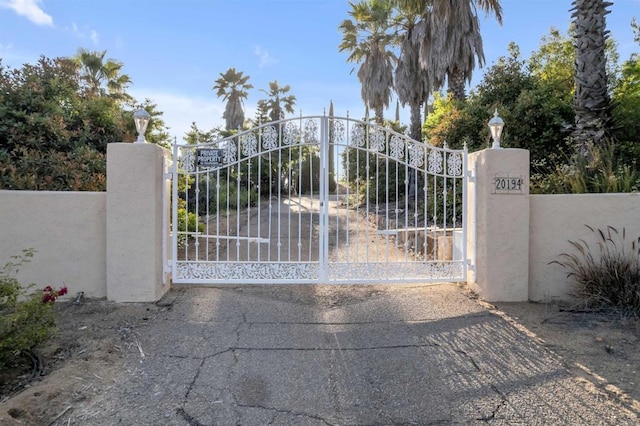 view of gate featuring fence