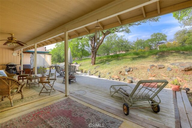 wooden deck with ceiling fan