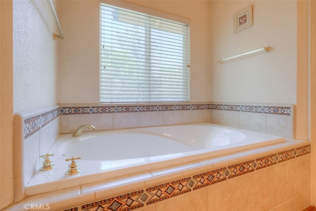 bathroom featuring tiled tub