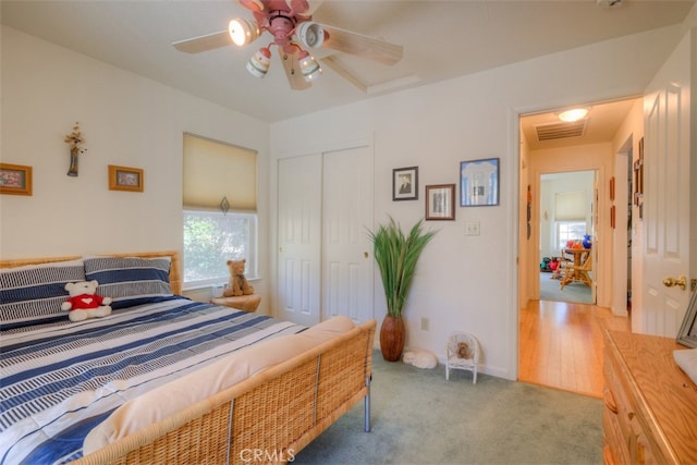 bedroom featuring a closet, ceiling fan, and hardwood / wood-style floors