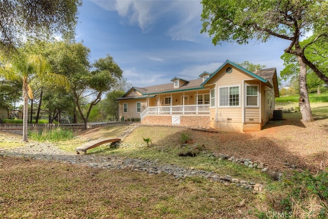 view of front of property featuring a porch and central AC unit