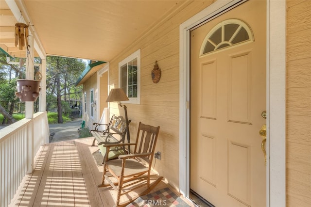 doorway to property with a porch