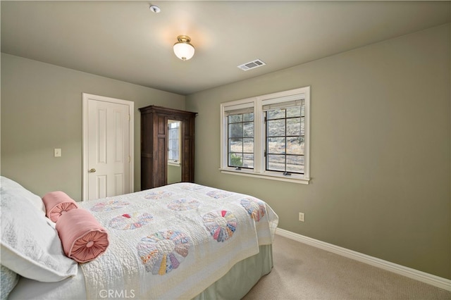 bedroom featuring light colored carpet