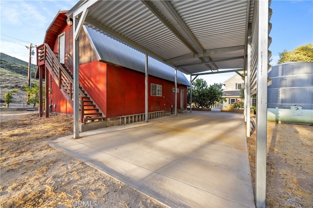 view of property exterior with a carport