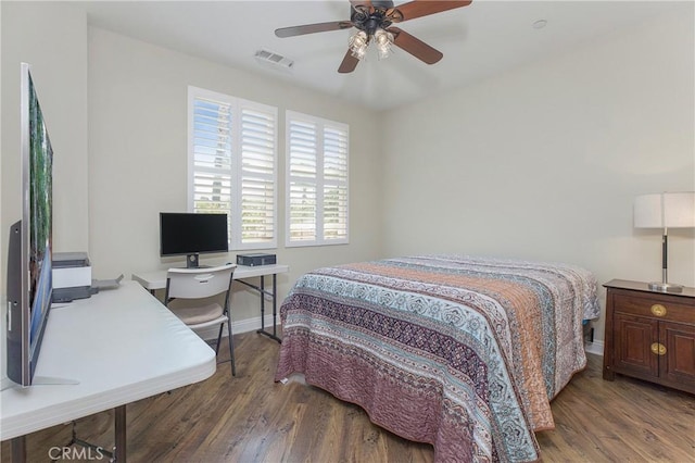 bedroom with dark wood-type flooring and ceiling fan