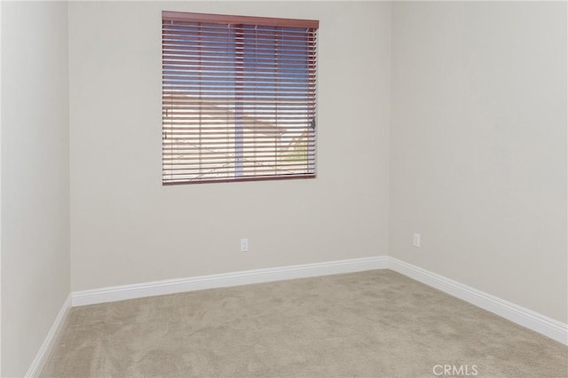 empty room featuring light colored carpet