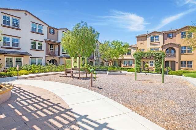 view of property's community with a playground