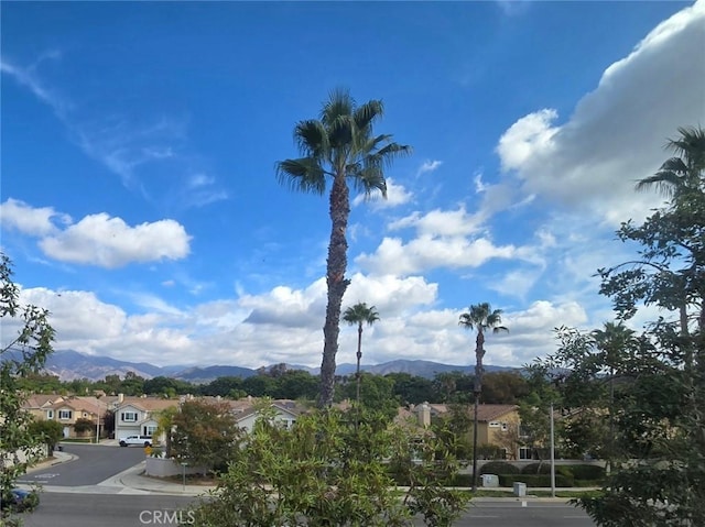 exterior space with a mountain view and a residential view