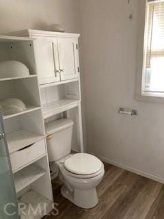 bathroom featuring hardwood / wood-style floors and toilet