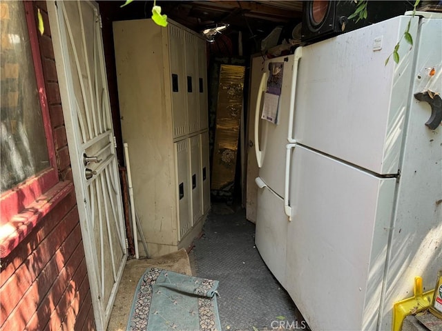 kitchen featuring freestanding refrigerator