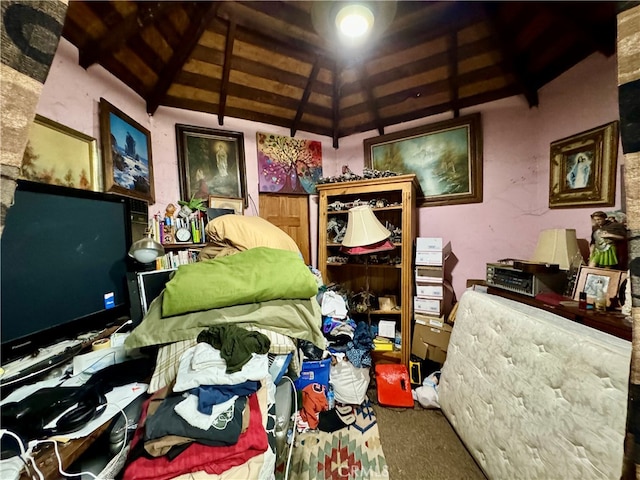 misc room with lofted ceiling with beams and carpet