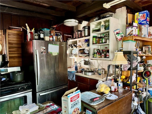 kitchen with freestanding refrigerator and open shelves