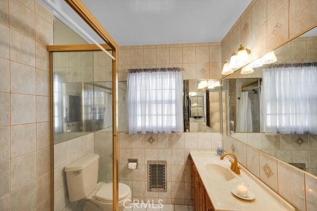 bathroom with a shower with shower curtain, heating unit, tile walls, and a healthy amount of sunlight