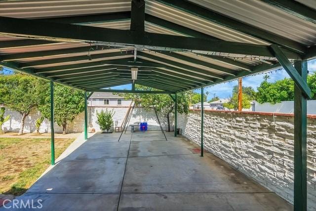 view of parking / parking lot with fence