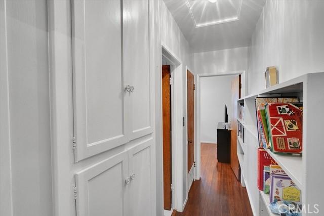 hallway with dark wood-style flooring