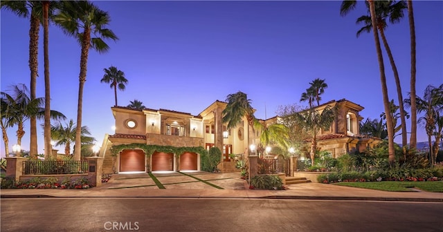 mediterranean / spanish house with a garage