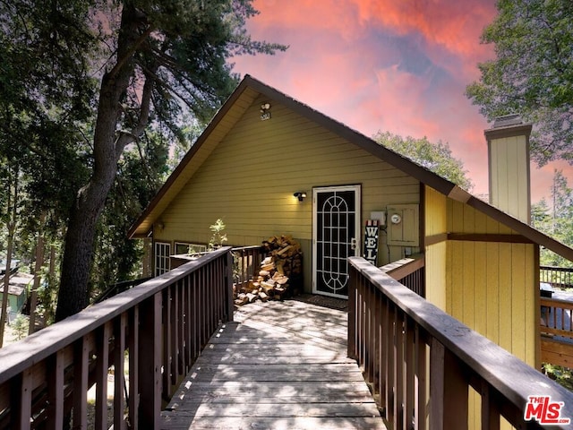 view of back house at dusk