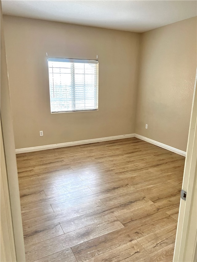 unfurnished room featuring light wood-type flooring