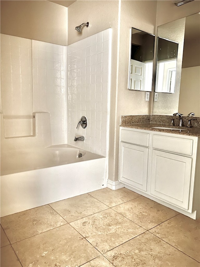 bathroom featuring vanity, tile patterned flooring, and shower / bathtub combination