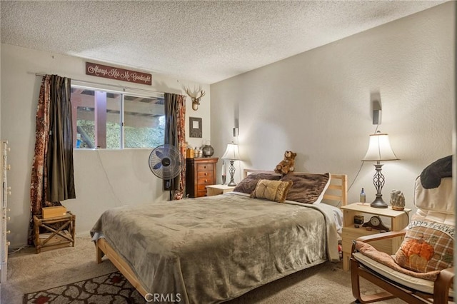 bedroom featuring light carpet and a textured ceiling