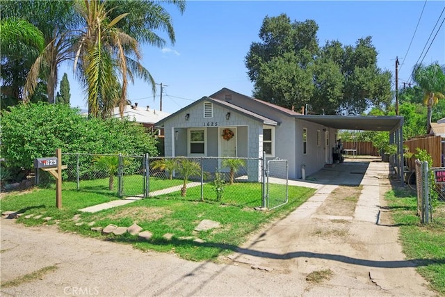 view of front of property with a front yard and a carport