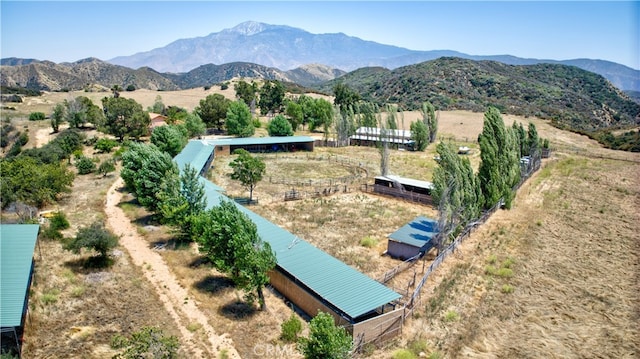 drone / aerial view with a mountain view and a rural view