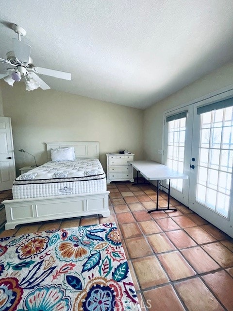 bedroom featuring ceiling fan, access to outside, a textured ceiling, french doors, and tile patterned floors