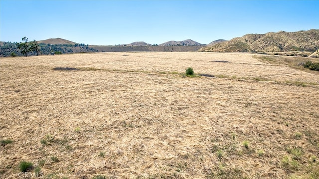 property view of mountains with a rural view