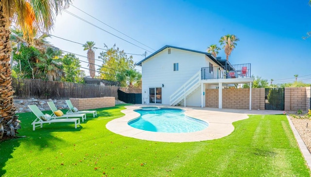 view of pool featuring a lawn, an in ground hot tub, and a patio