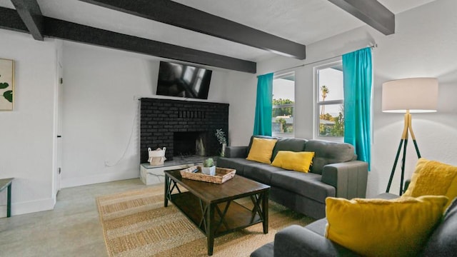 living room featuring beamed ceiling and a brick fireplace