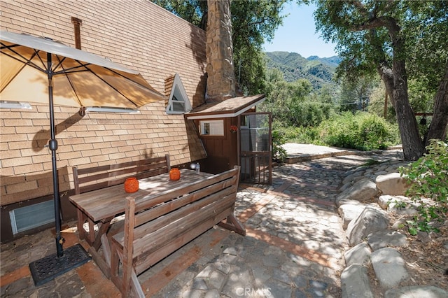 view of patio / terrace featuring a mountain view