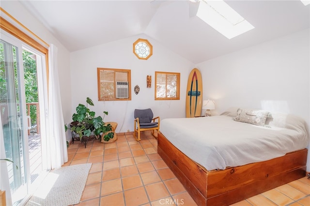 bedroom with access to outside, ceiling fan, vaulted ceiling with skylight, and light tile patterned floors