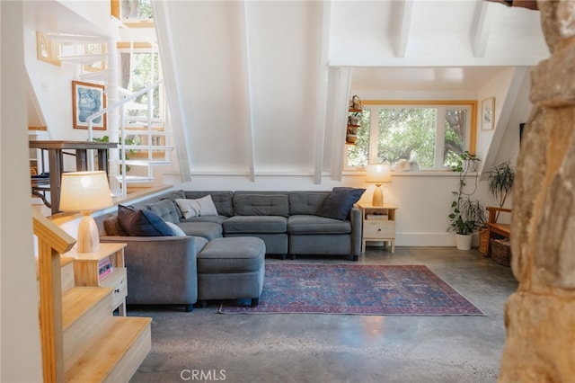 living room featuring beamed ceiling