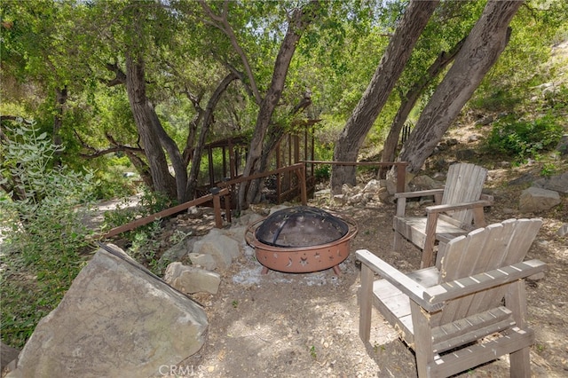 view of patio / terrace featuring an outdoor fire pit