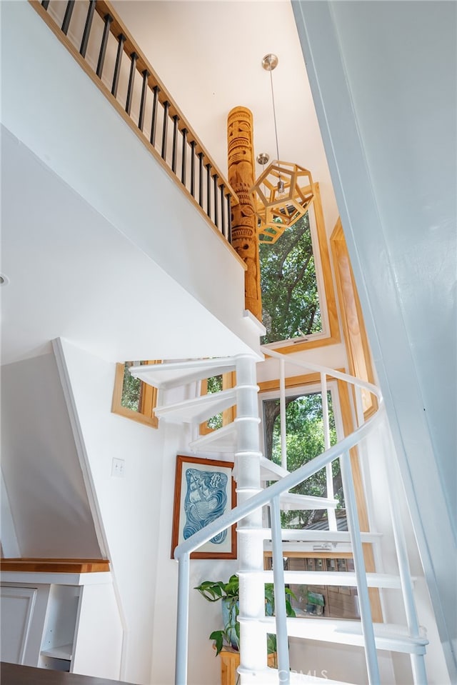 stairway featuring a high ceiling