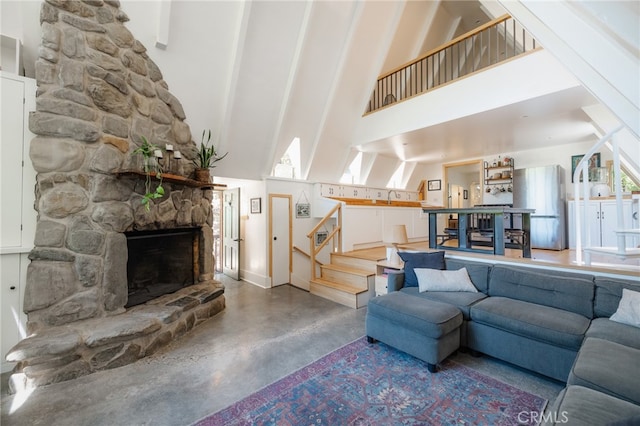 unfurnished living room with concrete flooring, high vaulted ceiling, beamed ceiling, and a stone fireplace