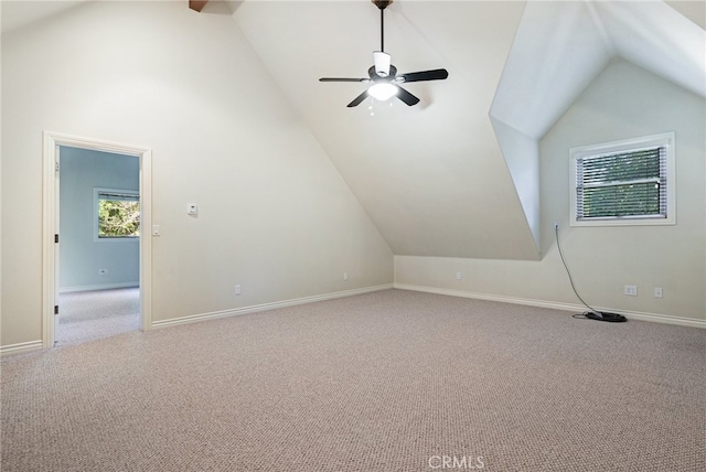 bonus room featuring ceiling fan, lofted ceiling, and light colored carpet