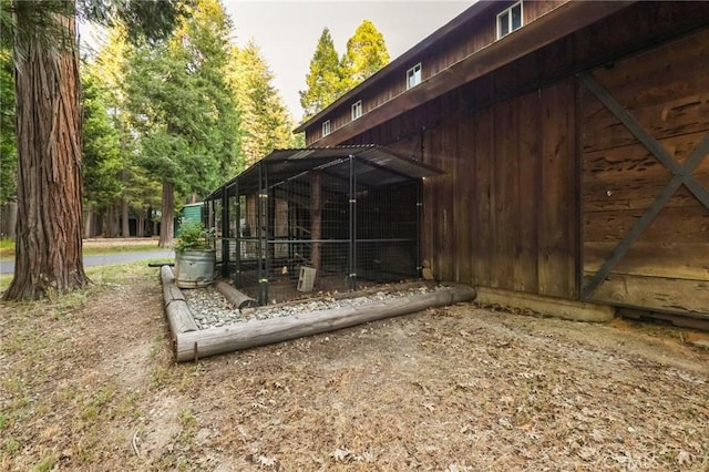 view of side of property with an outdoor structure