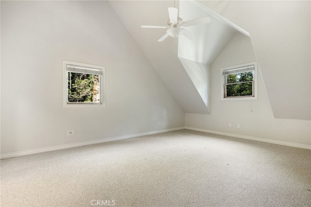 bonus room featuring lofted ceiling, carpet flooring, and ceiling fan