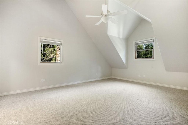 bonus room with ceiling fan, carpet floors, vaulted ceiling, and baseboards