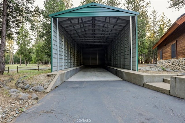 view of vehicle parking with a carport