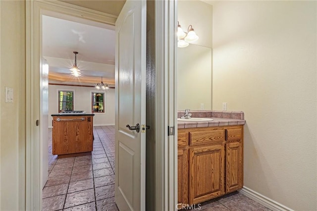 bathroom featuring vanity and baseboards