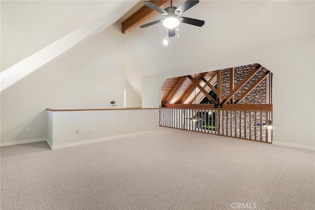 additional living space with baseboards, a ceiling fan, beamed ceiling, carpet, and high vaulted ceiling