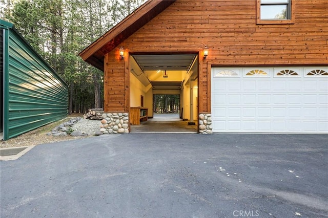 garage featuring driveway