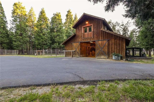 view of barn with an exterior structure